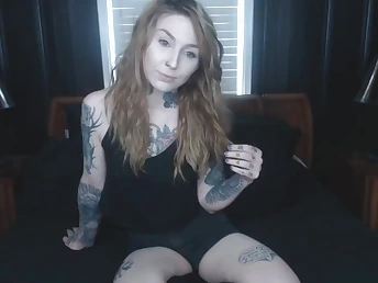 Tattoed cute teen solo striptease demonstrates