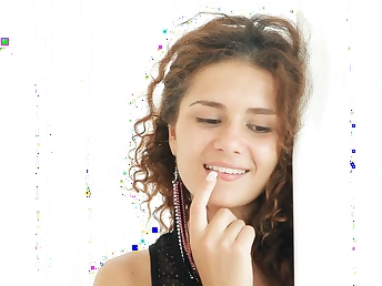 Curly haired sweetie enjoys being shot by cam