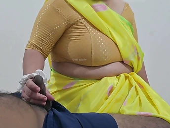 Desi maid Safiya spunks her client yon a red-hot hand job and thick melons